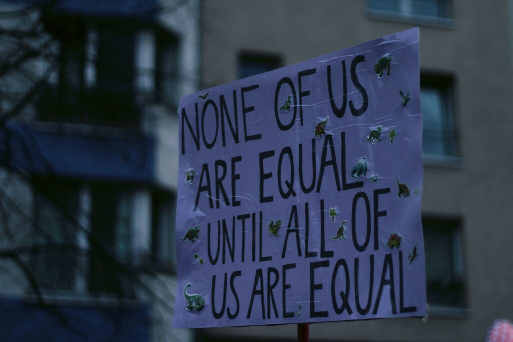 Sign that says "None of us are equal until all of us are equal"