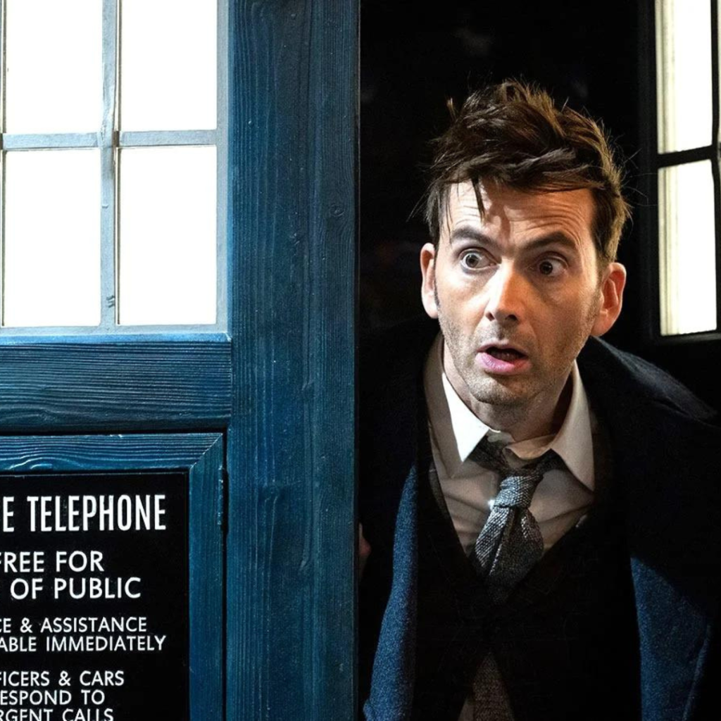 David Tennant as the 14th Doctor sticking his head out of the TARDIS
