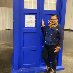 Talia in Fugitive Doctor cosplay with the Tardis
