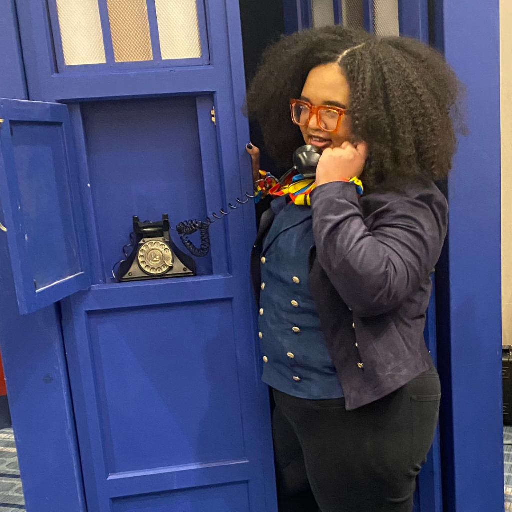 Talia in Fugitive Doctor Cosplay talking into a the TARDIS phone