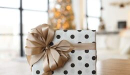 black and white polka dot gift with a ribbon